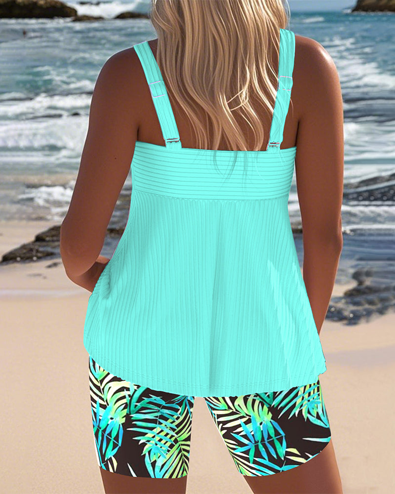 Striped Tankini with Printed Top and Matching Beach Shorts

Rewritten: "Striped Tankini with Decorative Top and Matching Beach Shorts"